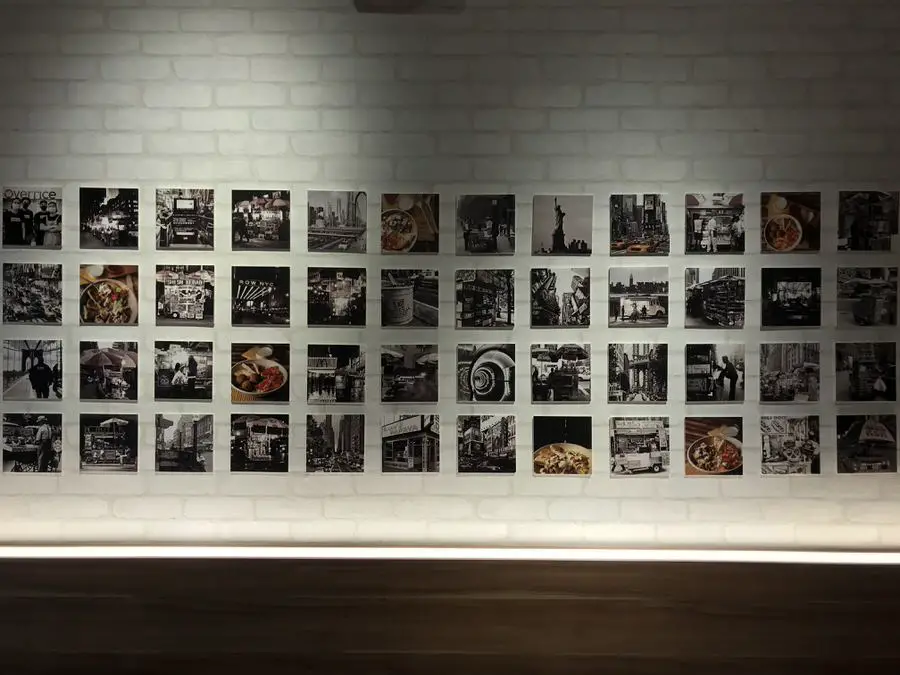 Photos of NYC line the wall