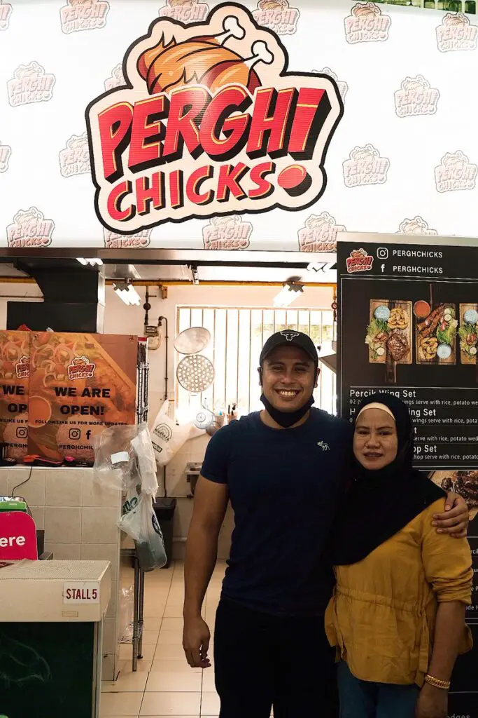 Afiq with his mum at their shop in Jurong West