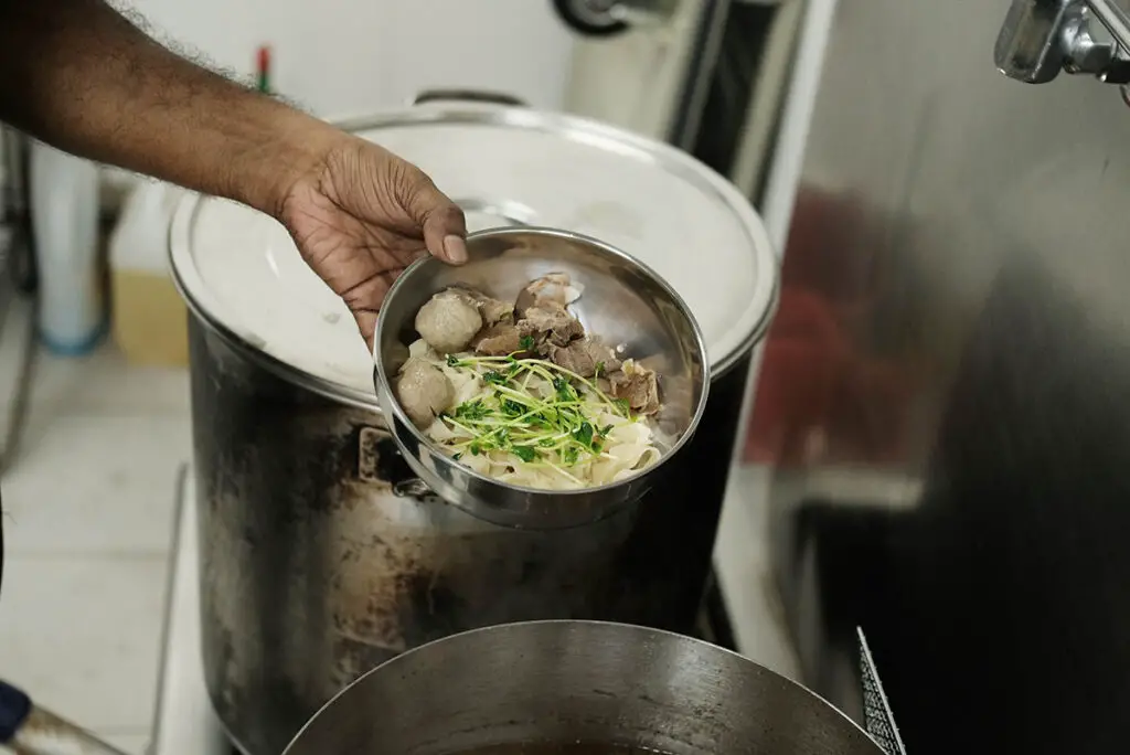 Roy preparing the beef noodles