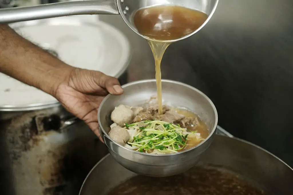 Roy pouring soup