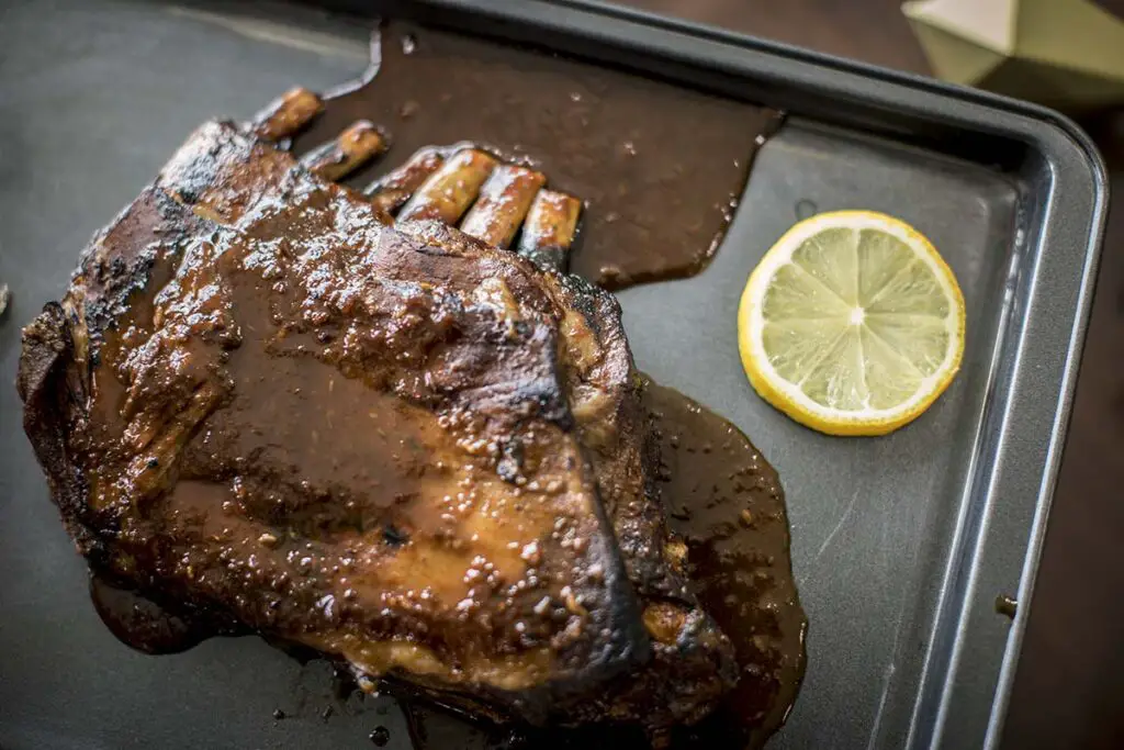 Top down view of lamb ribs with sauce